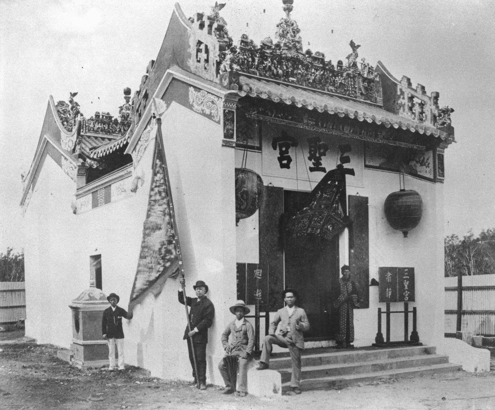 Holy Triad Temple, Breakfast Creek, 1886. The entrance and decorated roof frame the people gathered outside.
